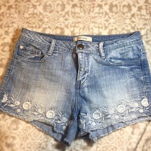 Embroidered distressed blue jean shorts